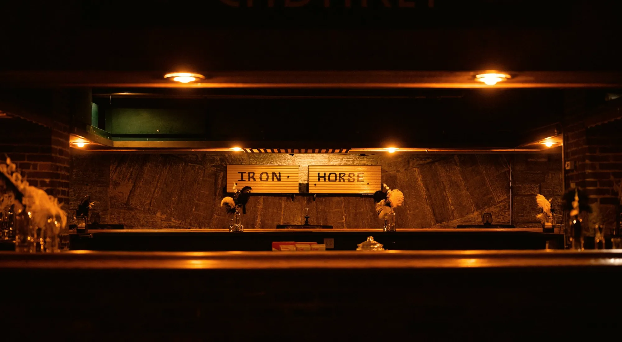 Warmly lit bar counter at night