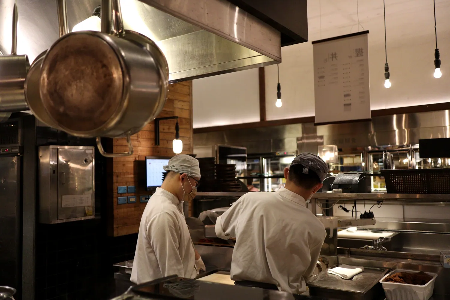 Line cooks working a busy restaurant kitchen
