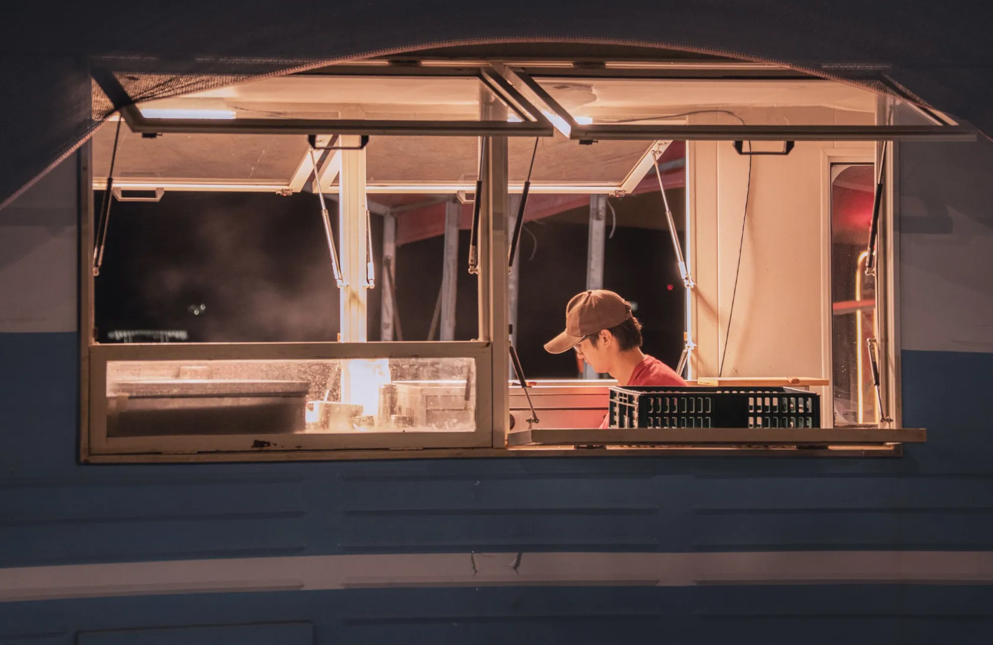 Food truck service window open at night