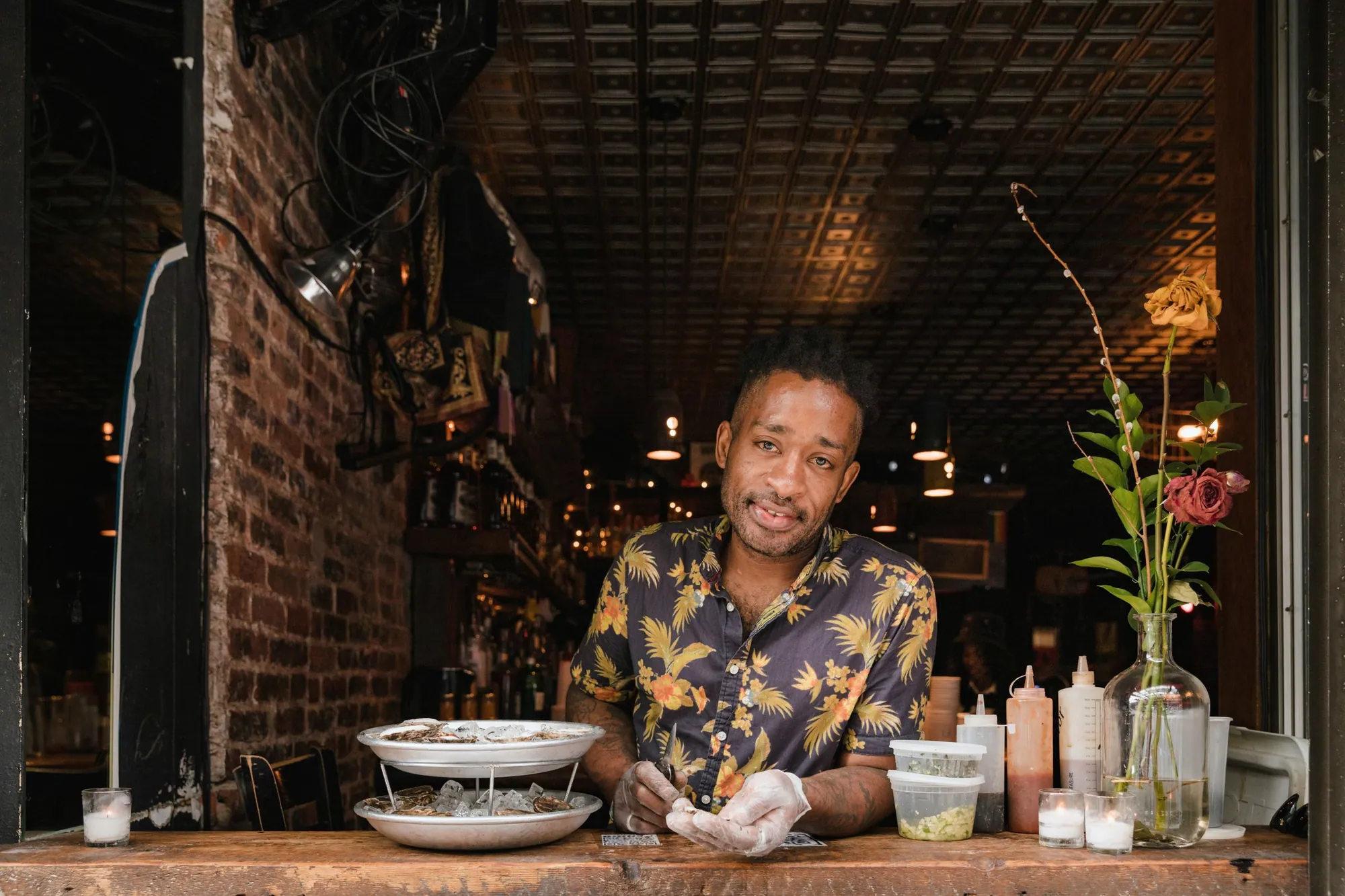 Restaurant owner preparing food behind his counter