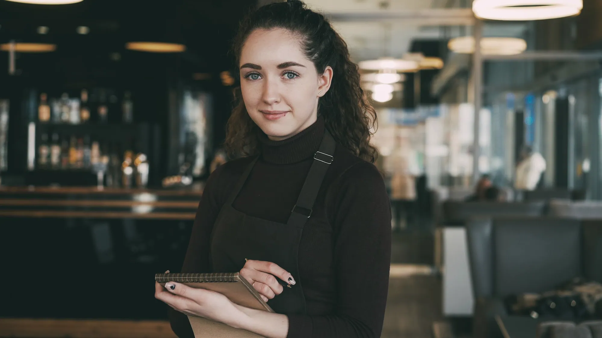 Server with a notepad ready to take an order