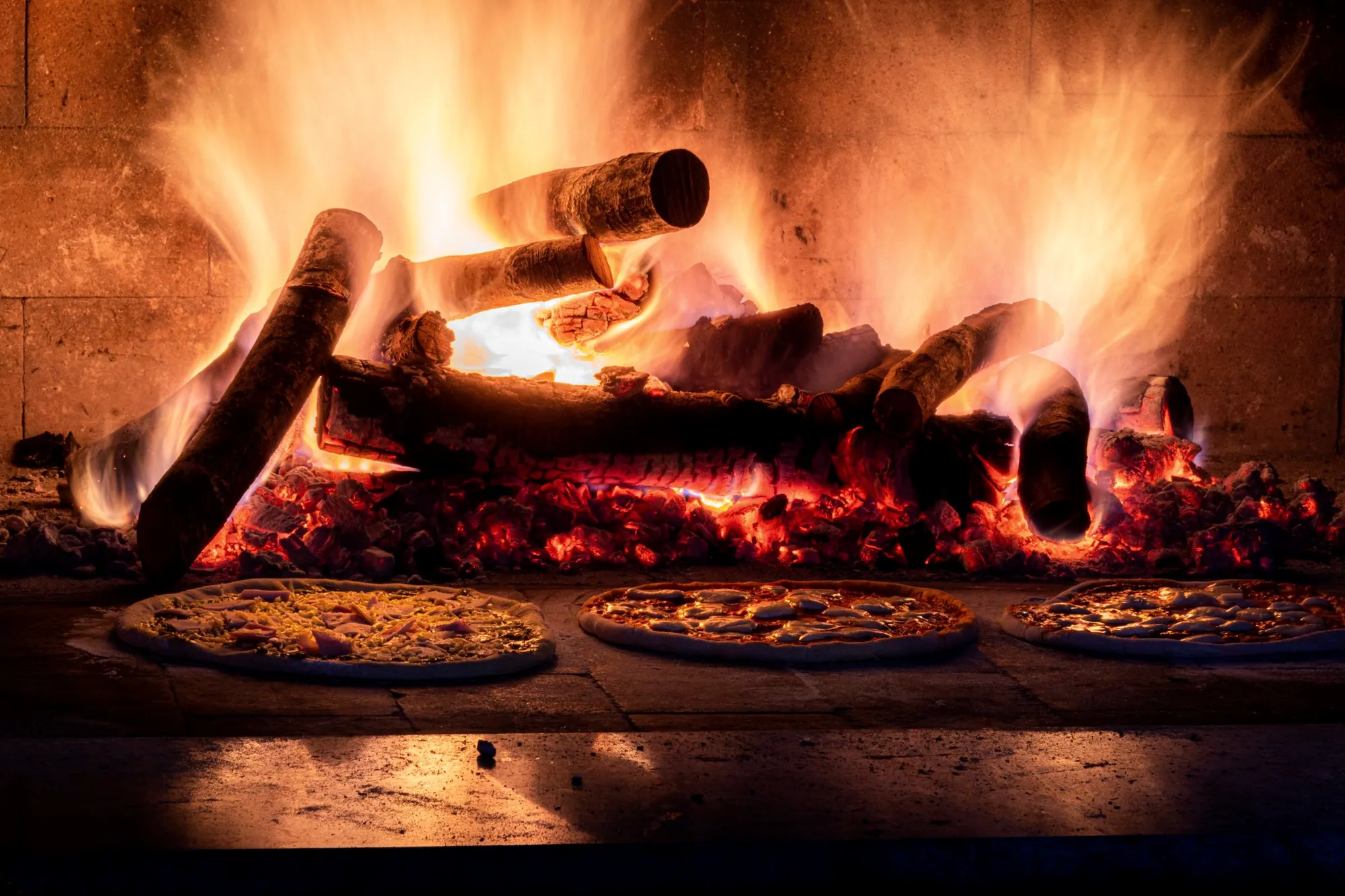 Wood fired oven with pizzas baking